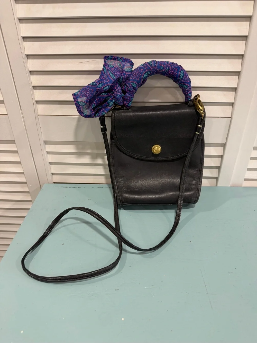 Classic Black Leather Crossbody Bag with Purple Scarf Accent